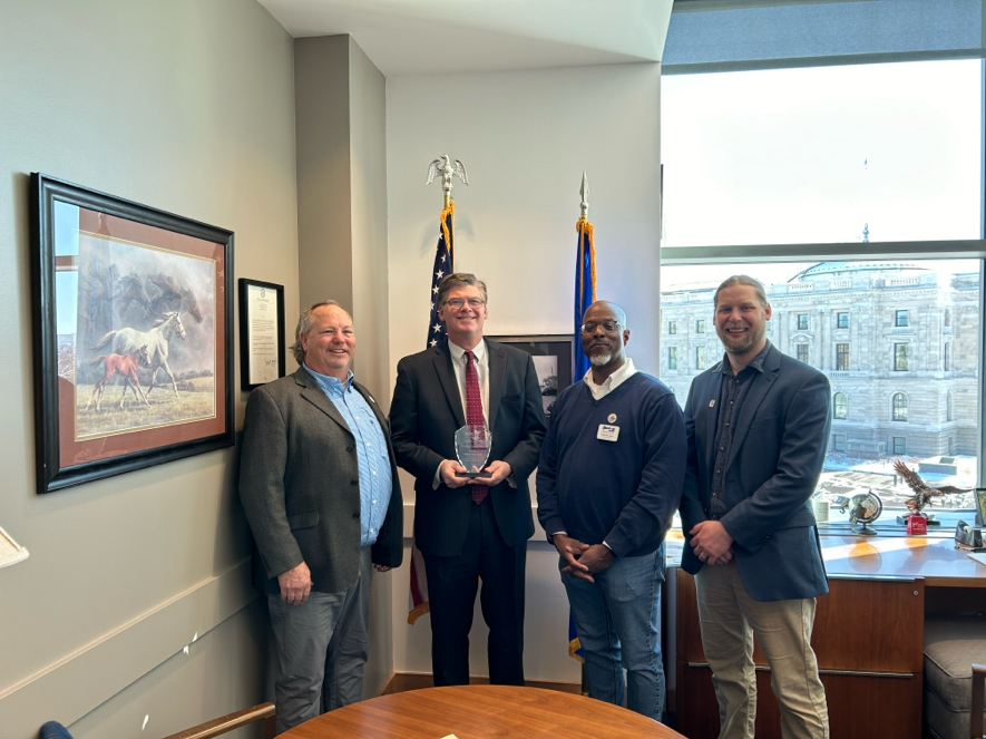 Coalition officers present award to Senator Pratt